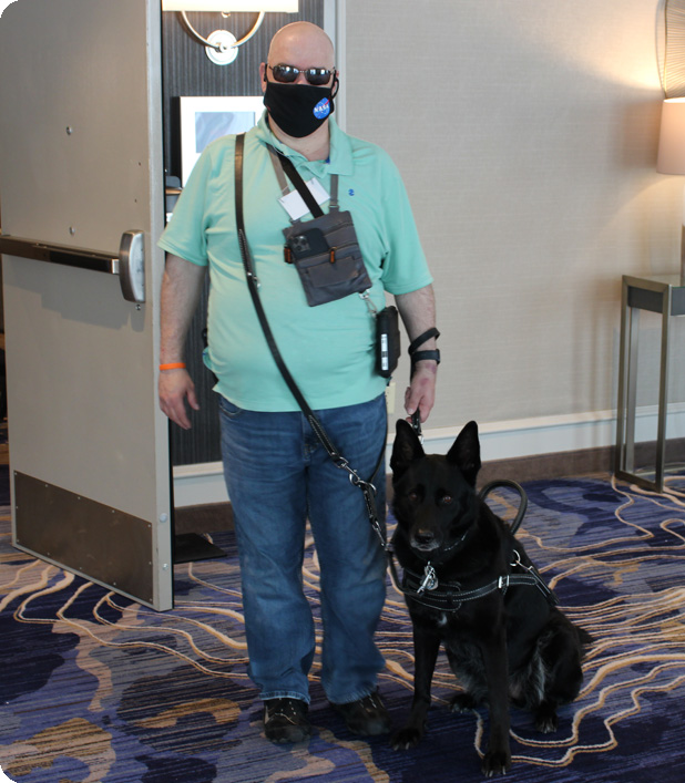 NFB of Ohio member Kelly poses for a picture with his guide dog.